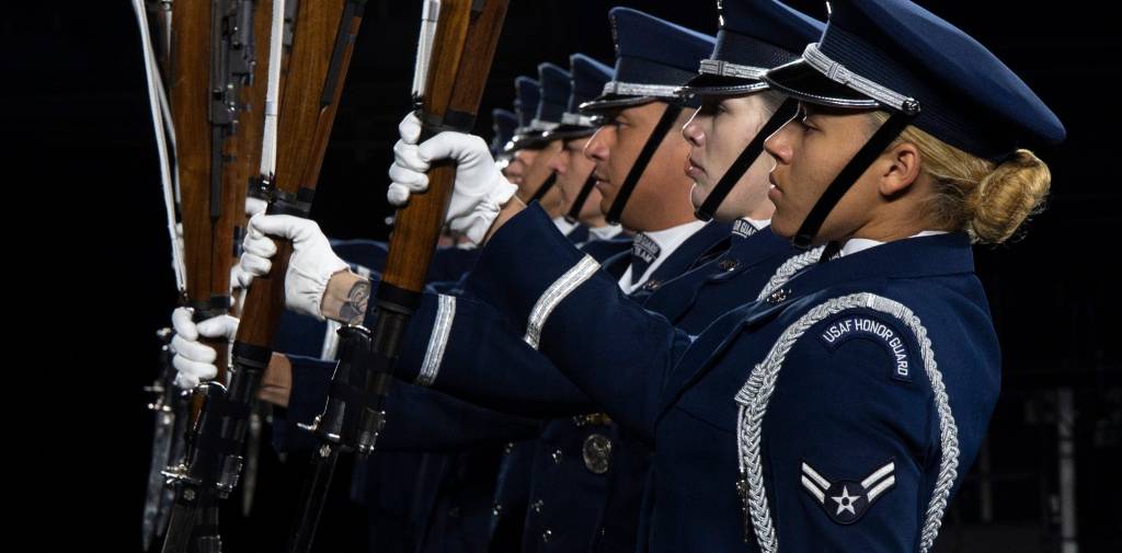 Members of the U.S. Air Force Honor Guard Drill Team conduct a Marine pitchout drill movement during the rehearsal of the 75th Royal Edinburgh Military Tattoo in Edinburgh, Scotland, July 31, 2025. The Drill Team performs more than 100 times a year at various events, such as national sporting events and international tattoos, showcasing the Air Force’s readiness and focusing on excellence. (U.S. Air Force photo by Hayden Hallman)
