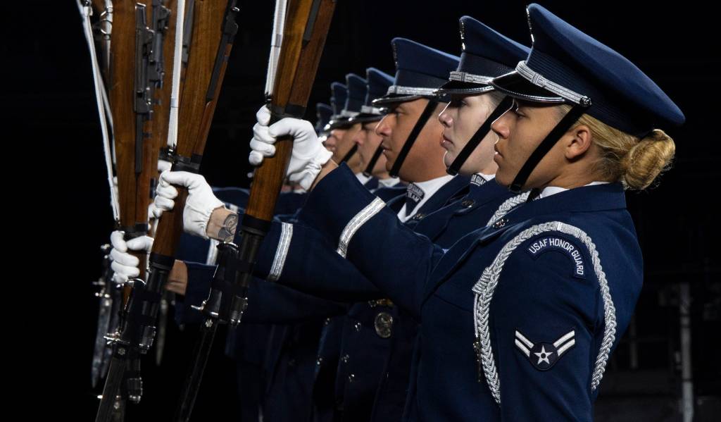 Members of the U.S. Air Force Honor Guard Drill Team conduct a Marine pitchout drill movement during the rehearsal of the 75th Royal Edinburgh Military Tattoo in Edinburgh, Scotland, July 31, 2025. The Drill Team performs more than 100 times a year at various events, such as national sporting events and international tattoos, showcasing the Air Force’s readiness and focusing on excellence. (U.S. Air Force photo by Hayden Hallman)