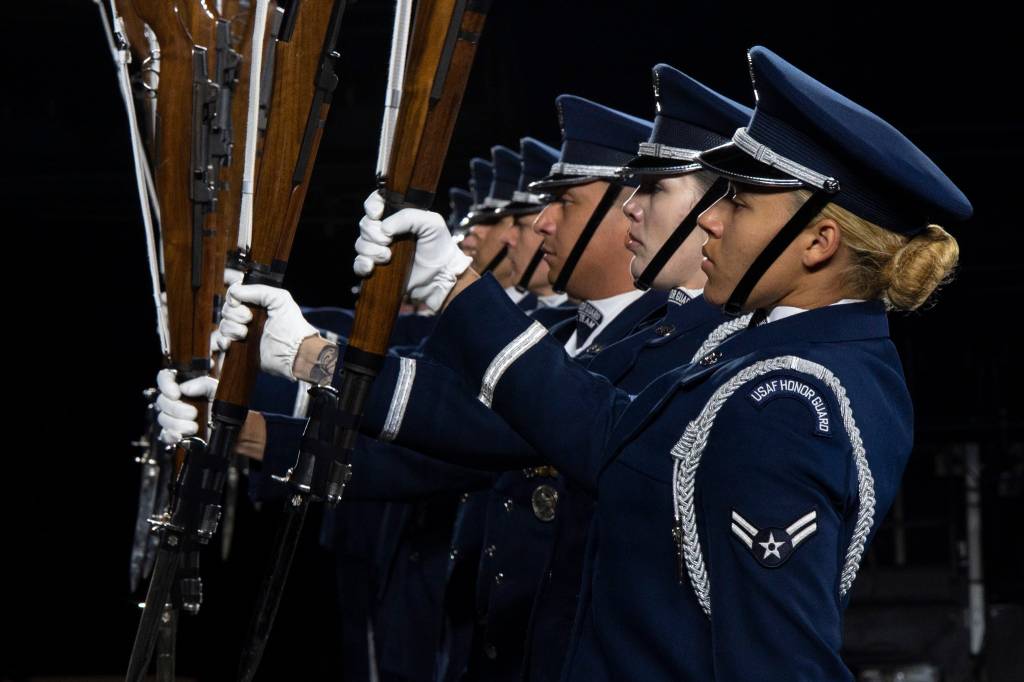 Members of the U.S. Air Force Honor Guard Drill Team conduct a Marine pitchout drill movement during the rehearsal of the 75th Royal Edinburgh Military Tattoo in Edinburgh, Scotland, July 31, 2025. The Drill Team performs more than 100 times a year at various events, such as national sporting events and international tattoos, showcasing the Air Force’s readiness and focusing on excellence. (U.S. Air Force photo by Hayden Hallman)